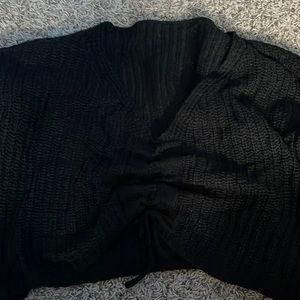 black sweater, adjust in the center